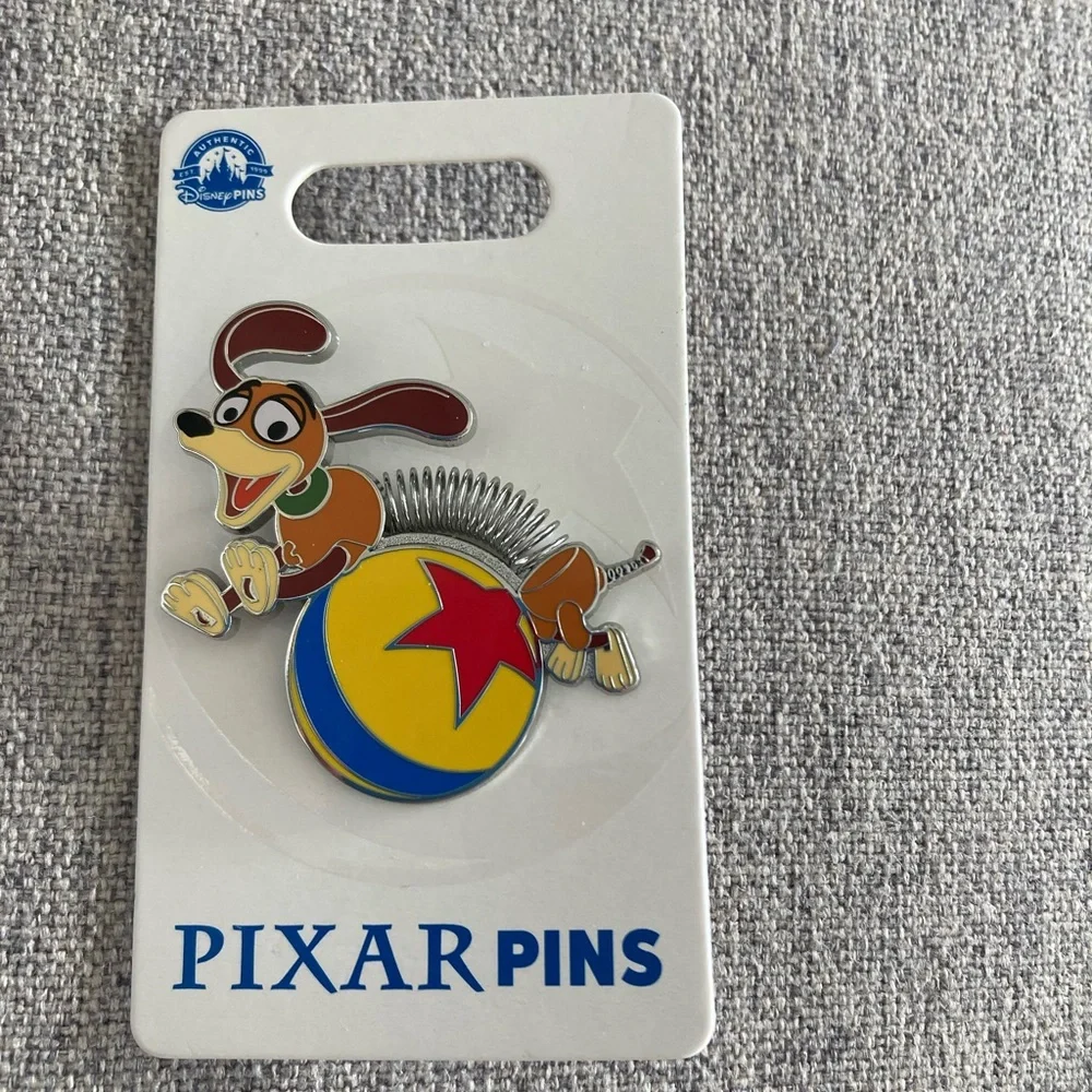 Pixar Toy Story Slinky Dog Pin w/ luxo ball - BNWT - Picture 1 of 2
